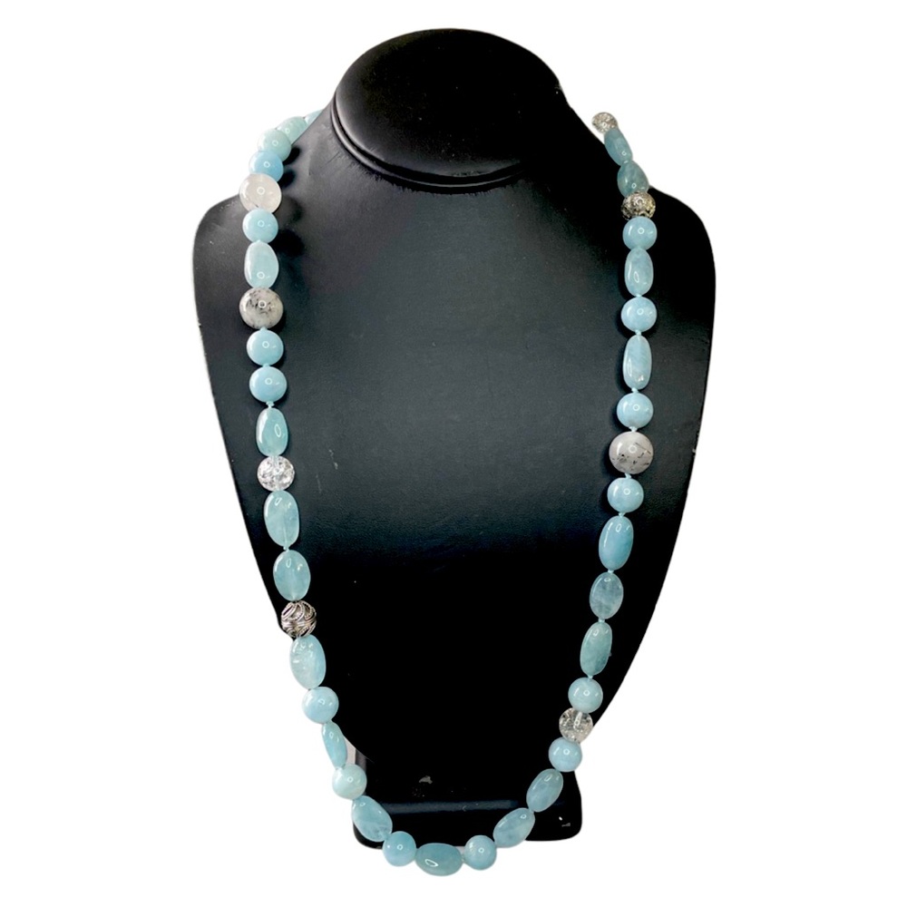 Aquamarine necklace with silver 4-leaf clover toggle clasp.